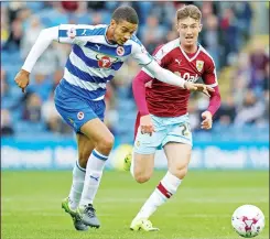  ??  ?? Reading’s Michael Hector and Burnley’s Chris Long in action