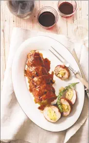  ??  ?? Pork tenderloin stuffed with apples.