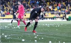  ?? ?? Play was suspended for 10 minutes at Livingston’s Tony Macaroni Arena after Rangers fans pelted the opposition penalty area with snowballs. Photograph: Ian MacNicol/Getty