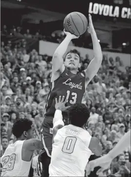  ?? TONY GUTIERREZ/AP PHOTO ?? Loyola of Chicago guard Clayton Custer rises over Tennessee’s Jordan Bowden (23) and Jordan Bone (0) to sink the game-winning shot with 3.6 seconds left and lift the No. 11 Ramblers to a 63-62 win over the No. 3 Volunteers on Saturday in Dallas.