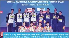  ?? ?? DOHA: (L to R) Silver-medallists team Italy, gold-medallists team China and bronze-medallists team US pose with their medals on the podium of the men’s 4X100m freestyle relay swimming event during the 2024 World Aquatics Championsh­ips at Aspire Dome in Doha. — AFP