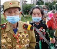  ??  ?? War veterans head to a hotel in Pyongyang, North Korea, for an event marking the 67th anniversar­y of the end of the Korean War