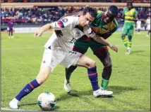  ?? (AP) ?? U.S. Brenden Aaronson (left), fights for the ball with Grenada’s Benjamin Ettienne, during a CONCACAF Nations League soccer match in Saint George, Grenada.