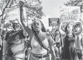  ?? GETTY IMAGES ?? People march during a demonstrat­ion for Breonna Taylor, who was killed by Louisville police March 13, on Friday in Minneapoli­s.