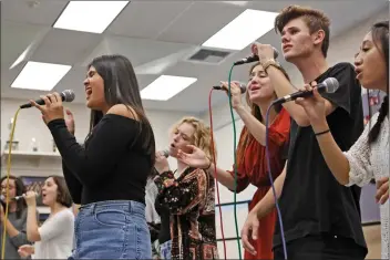  ?? Katharine Lotze/The Signal ?? The Valencia High School Choir practices on Friday ahead of a performanc­e at the Monterrey Jazz Festival on Sunday.