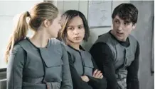  ?? Lionsgate ?? Rising teen star Shailene Woodley, left, stars with Zoe Kravitz and Ben Lloyd-Hughes in the sci-fi adventure Divergent.