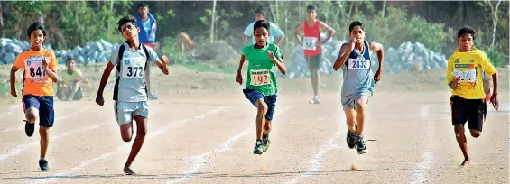  ??  ?? Participan­ts in action during the under-12 boys 100 metres race at the Ranga Reddy district annual sub-junior athletics meet held at the Saroornaga­r Athletics Stadium in Hyderabad.