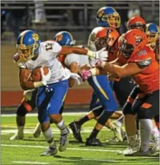  ?? ERIC HARTLINE — FOR DIGITAL FIRST MEDIA ?? Springfiel­d running back Ja’Den McKenzie, here pulling away from Marple Newtown defenders last Friday en route to an eight-yard touchdown run, is the top rusher in Delaware County with 900 yards. Fourteen of his rushes have been touchdowns.