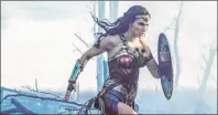  ?? CP PHOTO ?? This file image released by Warner Bros. Entertainm­ent shows Gal Gadot charging through No Man’s Land during a First World War battle scene from “Wonder Woman.” After two consecutiv­e record-breaking years at the domestic box office, 2017 was the year...