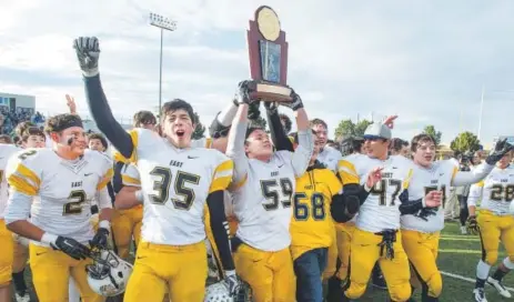  ??  ?? Pueblo East High School players celebrate after defeating Discovery Canyon in the Class 3A state championsh­ip game Saturday in Colorado Springs. Pueblo East won 35-6 to claim its third consecutiv­e championsh­ip. Chris McLean, The Pueblo Chieftain