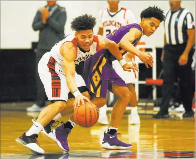  ?? Bridget Bennett Las Vegas Review-journal ?? Durango’s Anthony Hunter, right, and Las Vegas’ Donovan Joyner fight for a loose ball.