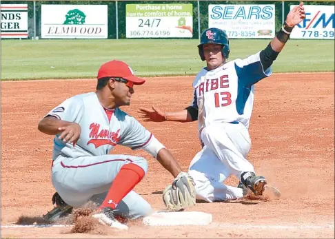  ?? Photo by Steven Mah ?? Fros Modena slid safely into third base during Sunday’s 6-4 comeback win over the visiting Medicine Hat Mavericks.