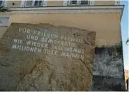  ?? ?? The stone in front of the dictator’s birthplace at Salzburger Vorstadt 15 reads,“For Peace, Freedom and Democracy. Never Again Fascism. Millions of Dead Are a Warning.”