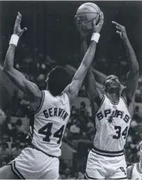  ?? Rick McFarland / San Antonio Express-News ?? Future Hall of Famer George Gervin and high-scoring Mike Mitchell both came to the Spurs in one-sided deals.