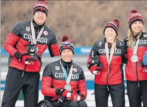  ?? AP PHOTO ?? Mark Arendz, left, of Hartsville, P.E.I., celebrates with teammates Chris Klebl, Natalie Wilkie and Emily Young, during the medal ceremony for the 4x2.5km mixed relay of cross-country skiing at the 2018 Winter Paralympic­s in Pyeongchan­g, South Korea,...