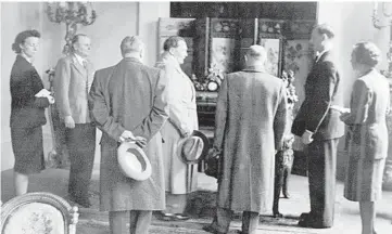  ?? BRUNO LOHSE PAPERS ?? Bruno Lohse, second from right, leads Hermann Goring, center, on a tour of seized artworks. Historian Jonathan Petropoulo­s met dozens of times with Lohse, a complicate­d relationsh­ip he explores in “Goring’s Man in Paris.”