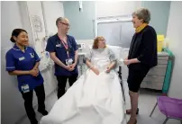  ?? AFP ?? Prime Minister Theresa May speaks to patient Sandra Dunn as she visits Frimley Park Hospital near Camberley on Thursday. —