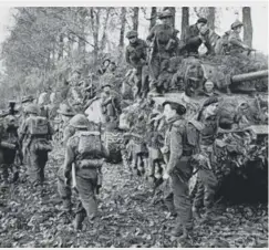  ??  ?? ↑ After being forced to dig his own grave, the soldier, perhaps named Len Scott Keller, who fought in Normandy in 1940 against the Nazis, was positioned against the cemetery wall and shot