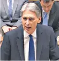  ??  ?? Mr Hammond delivers his statement