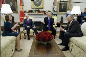  ?? EVAN VUCCI — THE ASSOCIATED PRESS ?? In this photo, President Donald Trump and Vice President Mike Pence meet with Senate Minority Leader Chuck Schumer, D-N.Y., and House Minority Leader Nancy Pelosi, D-Calif., in the Oval Office of the White House in Washington.