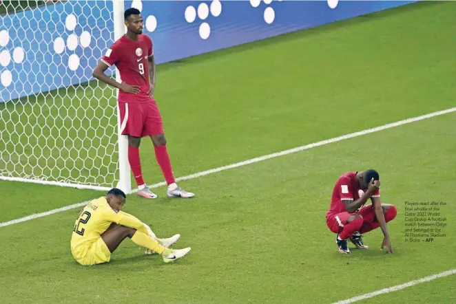  ?? — AFP ?? Players react after the final whistle of the Qatar 2022 World Cup Group A football match between Qatar and Senegal at the Al-thumama Stadium in Doha.