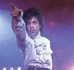  ?? WARNER BROS. ?? “Purple Rain” becomes “Purple Reign” when you connect Prince’s film to the royal rumpus of “Coming 2 America.”