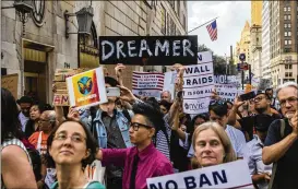  ?? HIROKO MASUIKE / NEW YORK TIMES ?? Protesters march last August in New York City against Trump administra­tion plans to cancel the Deferred Action for Childhood Arrivals program. The administra­tion sees the program started in 2012 as a misuse of executive power.