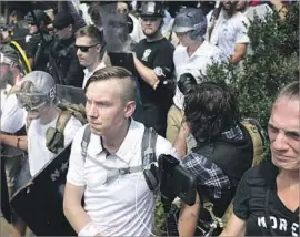  ?? Chip Somodevill­a Getty Images ?? MARCHERS in Charlottes­ville, Va., included white nationalis­ts and neo-Nazis.