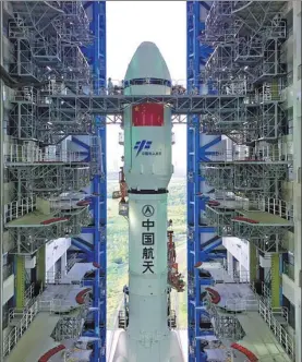  ?? ZHANG WENJUN / FOR CHINA DAILY ?? China’s first cargo spacecraft, Tianzhou 1, atop the new generation Long March 7 rocket, is moved Monday for its upcoming launch at the Wenchang Space Launch Center in Hainan province.