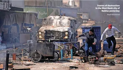  ?? Majdi Mohammed ?? > Scenes of destructio­n in the West Bank city of Nablus yesterday