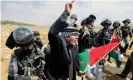  ?? Photograph: Mussa Issa Qawasma/Reuters ?? A Palestinia­n demonstrat­or gestures as he is pushed by border police officers during a protest in the Israeli-occupied West Bank.