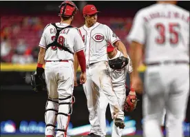  ?? JAMIE SABAU / GETTY IMAGES ?? In his first appearance since late May, Reds right-hander Homer Bailey allowed two runs and struck out a season-high eight in 6⅔ innings Tuesday.