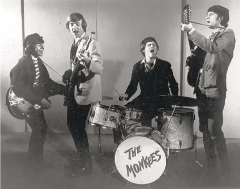  ?? AP PHOTOS ?? Micky Dolenz with The Monkees in 1966 (above, on drums) and performing in 2021 (below).