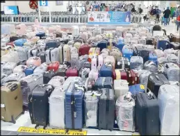  ?? RUDY SANTOS ?? The luggage of OFWs from Dubai are left at the customs arrival area as they undergo swab testing upon arrival at the NAIA Terminal 2.