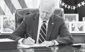  ?? Mandel Ngan / Getty Images file ?? President Joe Biden signed into law the $300 per week federal unemployme­nt boost in March. He says its expiration as scheduled is “appropriat­e.”