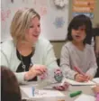  ??  ?? NDP Leader Andrea Horwath chose a candid photograph of her making Christmas cards with school-aged children in Hamilton.