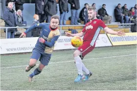  ??  ?? Skipping past Sean Winter beats his marker during EK’s win over Whitehill Welfare