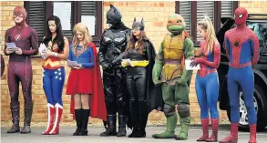  ??  ?? FAREWELL TO A HERO Costumed superheroe­s formed a guard of honour for Bradley