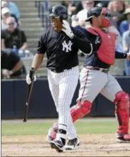  ?? LYNNE SLADKY - THE ASSOCIATED PRESS ?? New York Yankees pinch hitter Russell Wilson, a Seattle Seahawks quarterbac­k, left, walks off after striking out during the fifth inning of a baseball spring exhibition game against the Atlanta Braves, Friday, March 2, 2018, in Tampa, Fla. At right is...