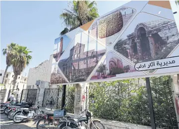  ??  ?? Visitors walk in the Idlib Museum after it reopened on Aug 13 in the northern Syrian city of Idlib.