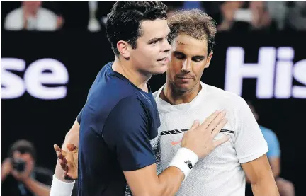  ?? ANDY BROWNBILL/THE ASSOCIATED PRESS ?? Milos Raonic, left, congratula­tes Rafael Nadal after their match in Melbourne, Australia, on Wednesday.