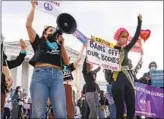  ?? Jacquelyn Martin Associated Press ?? ABORTION RIGHTS activists and their opponents rally outside the Supreme Court.