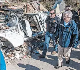  ?? MICKEY WELSH/AP ?? Alabama Gov. Kay Ivey tours tornado damage Wednesday in Beauregard.