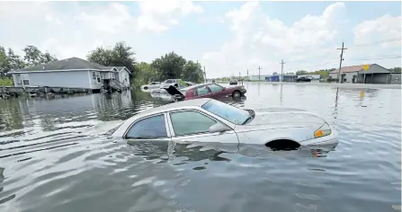  ?? GERALD HERBERT/THE ASSOCIATED PRESS ?? Flooded cars will have telltale signs that, even with a cursory view, will tell a story.