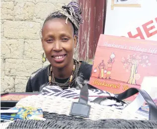  ?? PHOTO: JARED MORGAN ?? Giving back . . . Shukuru Munro displays her range of Tanzanian goods at the St Bathans Fete. All money she raises goes back to her former school in Tanzania.