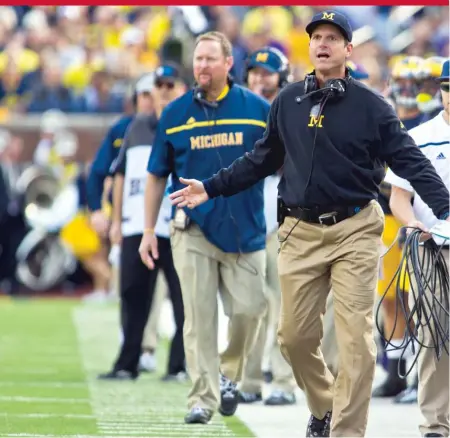  ?? | TONY DING/ AP ?? Michigan coach Jim Harbaugh was criticized by SEC and ACC teams for taking his squad to Florida to practice during spring break last March. A package of new rules will create more time off for college athletes, including during vacation periods.