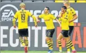 ?? REUTERS ?? Fist bumps and elbow-toelbow contact became the new modes of celebratio­n as football resumed in Germany with Borussia Dortmund crushing Schalke 4-0 on Saturday.