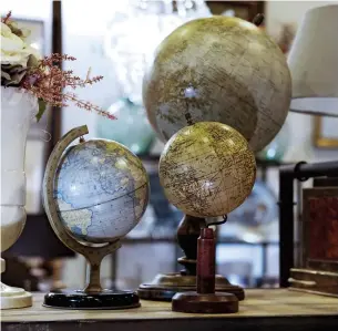  ??  ?? For love or money ... antiques and vintage items, from globes to dolls, can be highly collectibl­e.