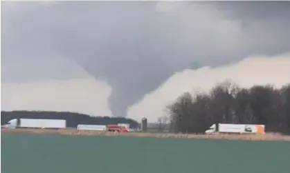  ?? ?? A view shows a tornado moving in Hancock county, Ohio, on Thursday. Photograph: Tom Simmons/Reuters