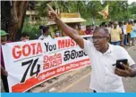  ?? ?? RAMBUKKANA, Sri Lanka: Janatha Vimukthi Peramuna party activists and supporters shout anti-government slogans during a demonstrat­ion in Rambukkana on April 20, 2022, a day after police killed an anti-government demonstrat­or while dispersing a protest against the high fuel prices and to demand President Gotabaya Rajapaksa’s resignatio­n over the worsening economic crisis. —AFP